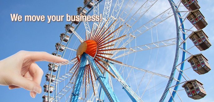 A hand is moving a ferris wheel.